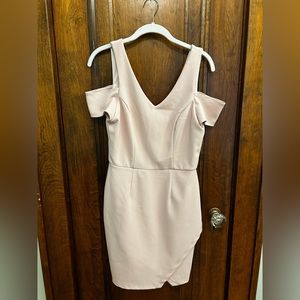 Light pink dress with sparkling fabric and slit with off the shoulder cut outs.